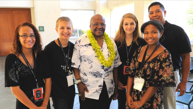 Students from Aliamanu Middle School with peace leader Desmond Tutu.