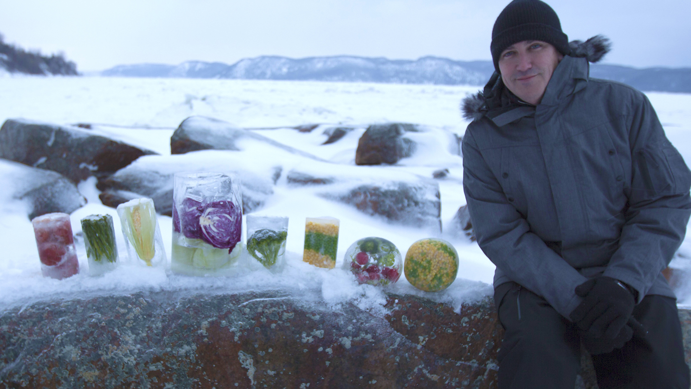 Steven Johnson showing off preserved food items in the cold.
