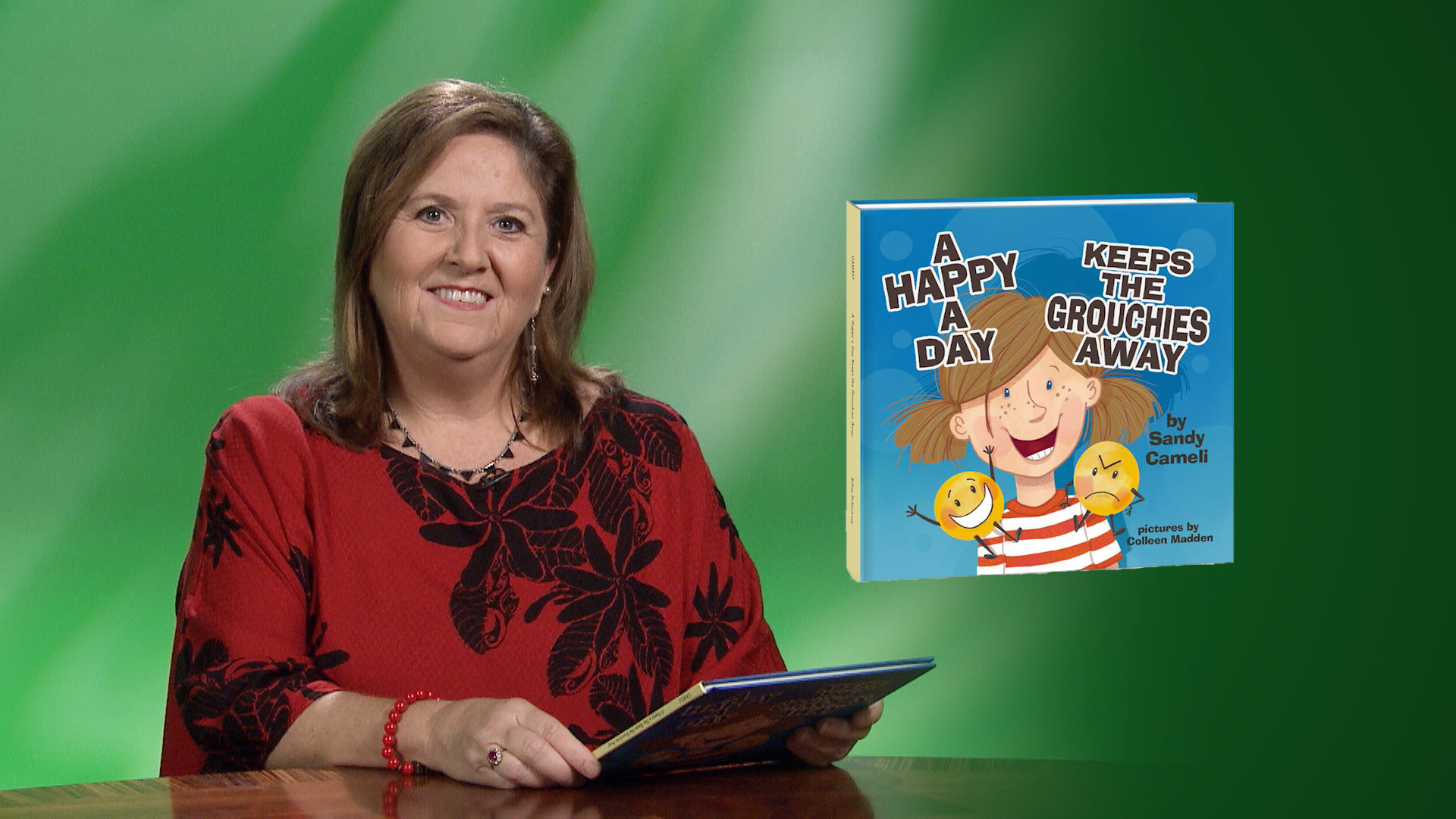Sandy Cameli reads “A Happy a Day Keeps the Grouchies Away” <br/>GET CAUGHT READING
