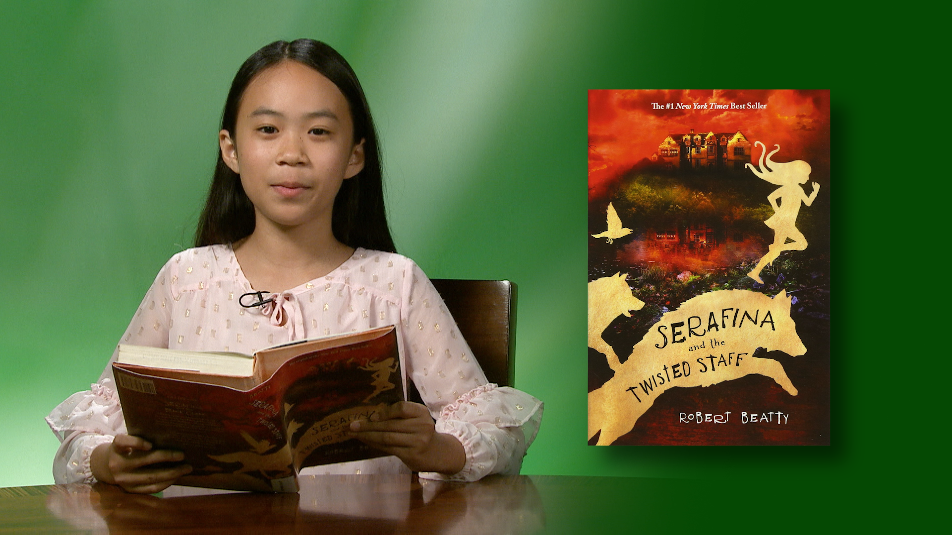 Kekupu Loo-Ching reads “Serafina and the Twisted Staff” <br/>GET CAUGHT READING