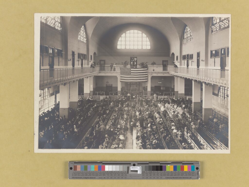 Immigrants seated on long benches, Main Hall, U.S. Immigration Station.
    RLIN/OCLC: NYPG95-F135
    NYPL catalog ID (B-number): b12326658