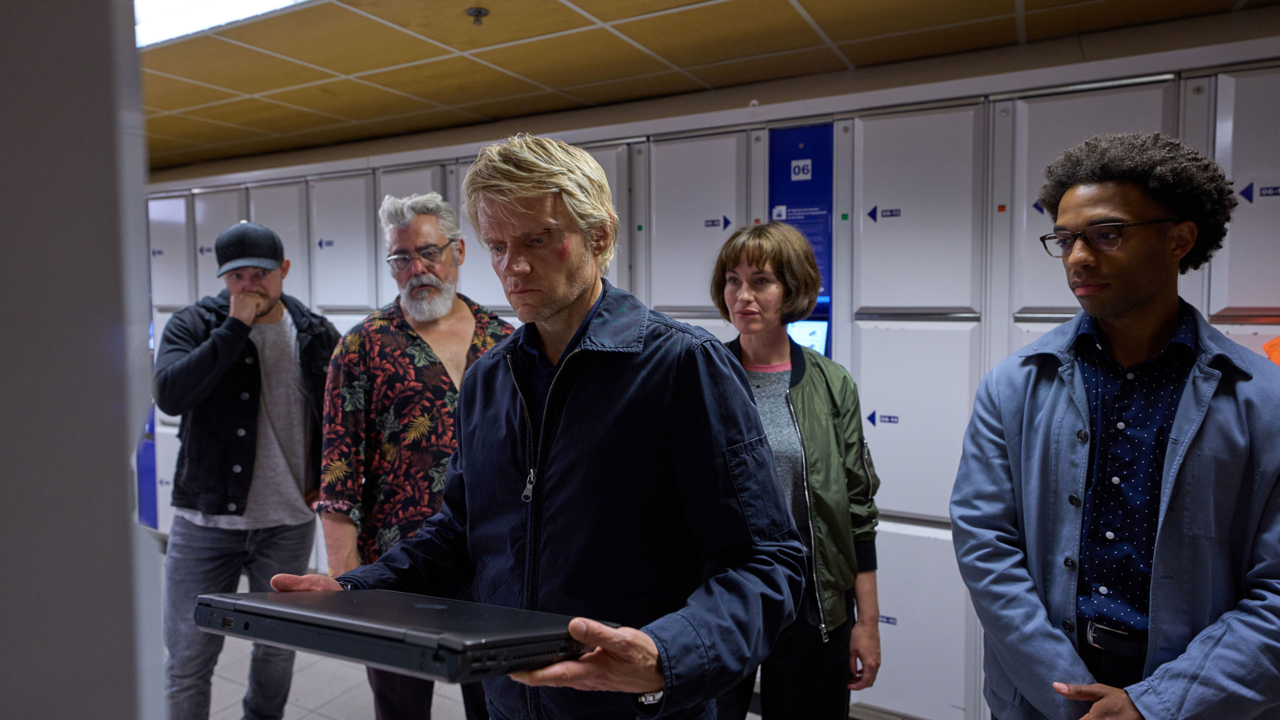 MASTERPIECE Mystery!
"Van der Valk" Season 2

Episode Three, “Payback in Amsterdam”
Sunday, October 9, 2022; 9-11pm ET on PBS
When a promising cellist from a prestigious orchestra dies following an acid attack, Van der Valk and his team have to delve into the city’s vibrant and
eclectic classical music scene in the search for her killer.

Shown from left to right: Luke Allen-Gale as Brad de Vries, Darrel D'Silva as Hendrik Davie, Marc Warren as Piet Van der Valk, Maimie McCoy as Lucienne Hassel, and Elliot Barnes-Worrell as Job Cloovers

For editorial use only.

© Company Pictures, NL Films &amp; A3MI