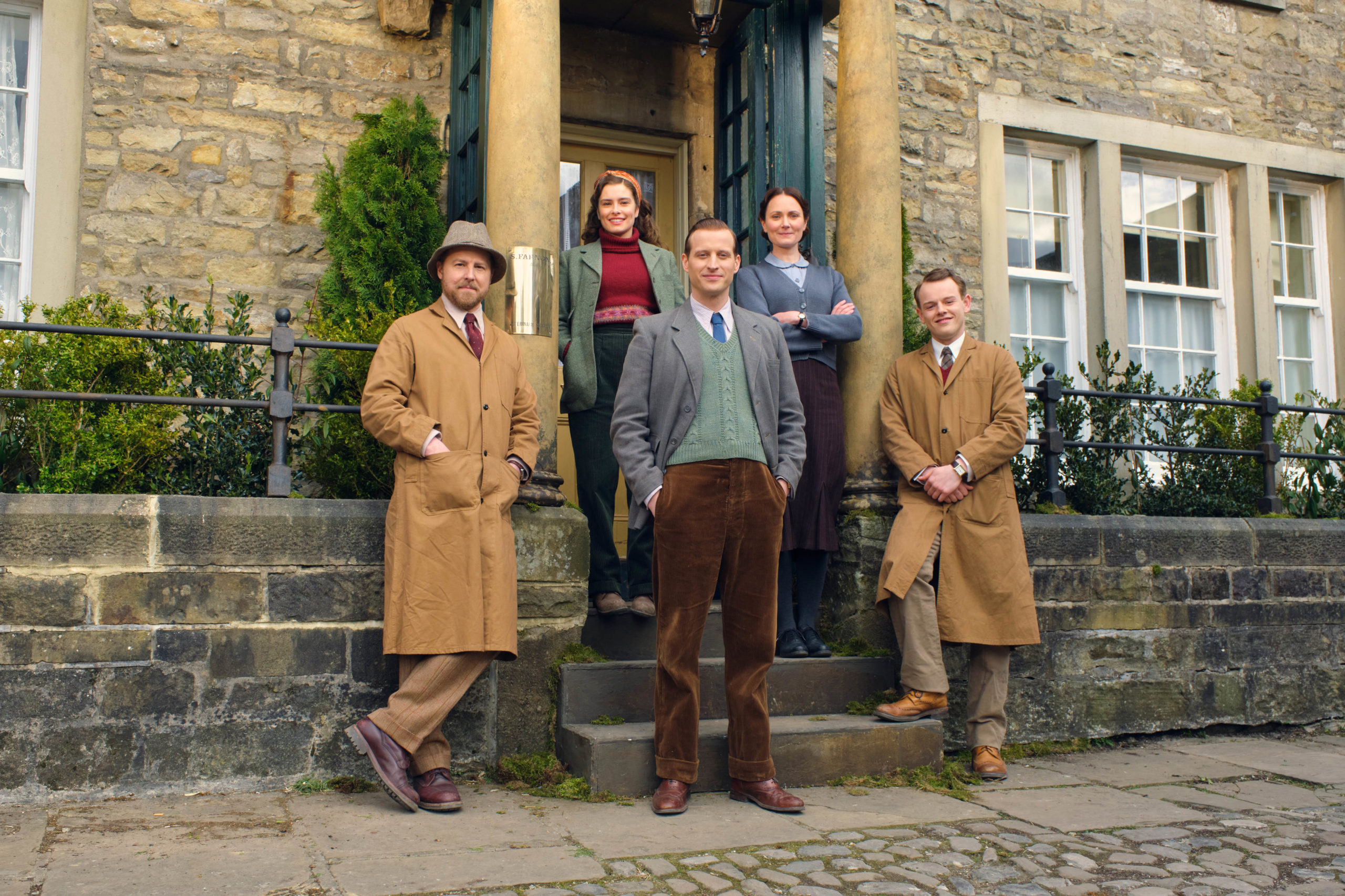 MASTERPIECE 
“All Creatures Great and Small” Season 2

Coming Soon to MASTERPIECE on PBS

Shown: FRONT LEFT TO RIGHT, SIEGFREID FARNON (SAMUEL WEST), JAMES HERRIOT (NICHOLAS RALPH) &amp; TRISTAN FARNON (CALLUM WOODHOUSE).
BACKROW: HELEN ALDERSON (RACHEL SHENTON) &amp; MRS HALL (ANNA MADELEY).

For editorial use only.

Courtesy of MASTERPIECE.
