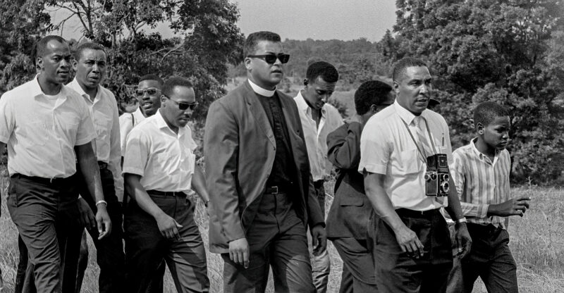 June 7, 1966; DeSoto County, MS, USA; Ernest Withers was there on June 7, 1966, when Dr. Martin Luther King and others participated in the James Meredith "March Against Fear." Meredith, the first African-American enrollee at the University of Mississippi, had been wounded by a sniper the day before near Hernando, Mississippi. King flew to Memphis and joined in to finish the rest of the march. In the front is Withers, with camera. Next to him (in sunglasses) is Rev. James Lawson. Martin Luther King is at left. Mandatory Credit: Fred Griffith-USA TODAY NETWORK