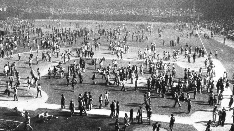 A capacity crowd storms the field at Comiskey Park on Disco Demolition Night, Chicago, Illinois. Chicago police were called in to clear the field.
